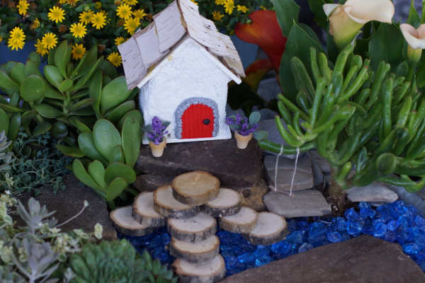 fairy garden with miniature pots of flowers