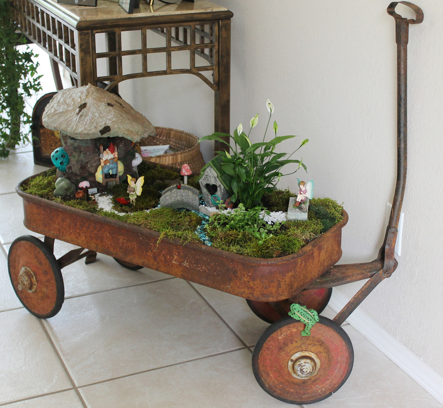 fairy garden in an old wagon