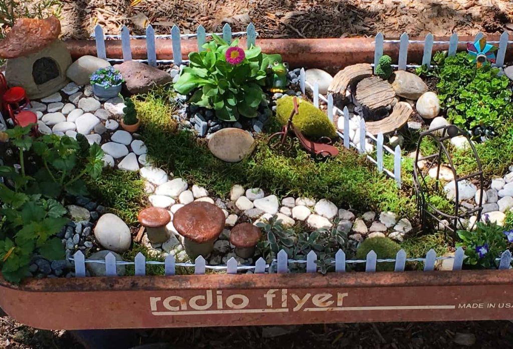 fairy garden in a kid's wagon