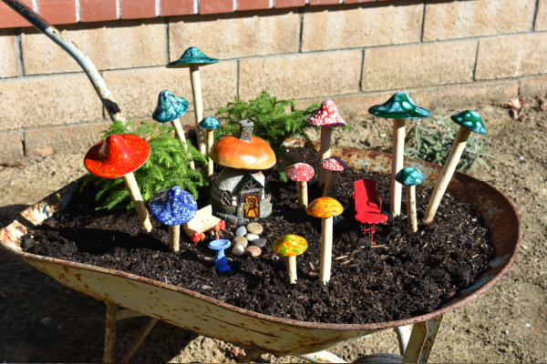 outdoor fairy garden container idea: wheelbarrow