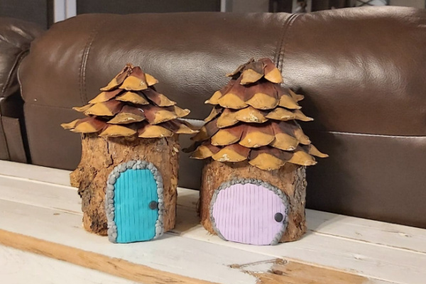 fairy garden house with pinecone roof