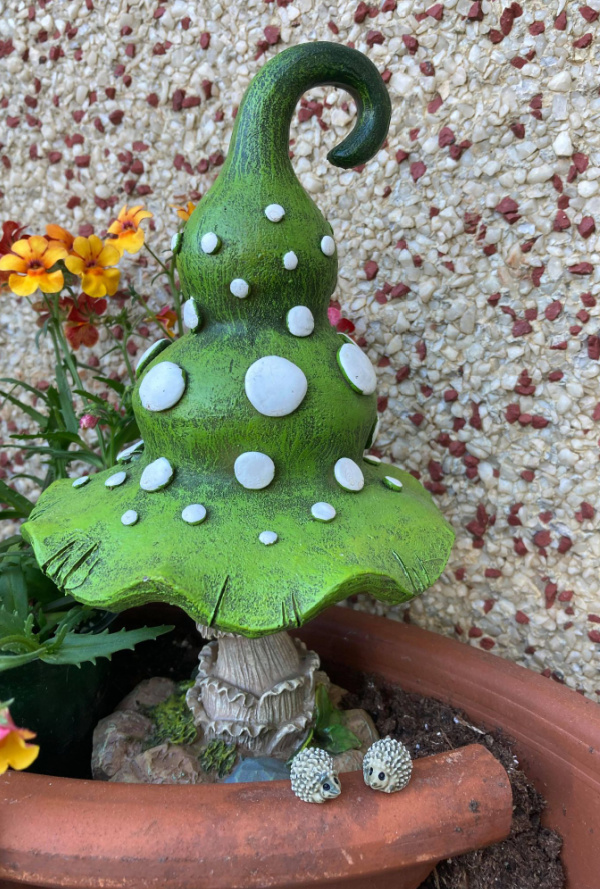 miniature hedgehogs and decorative mushroom