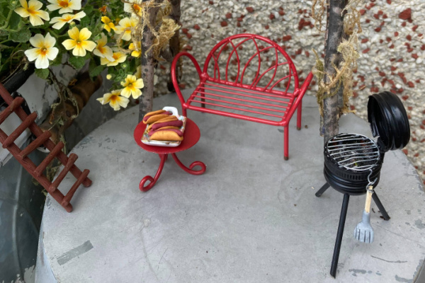 DIY mini BBQ and hot dogs by red bench 