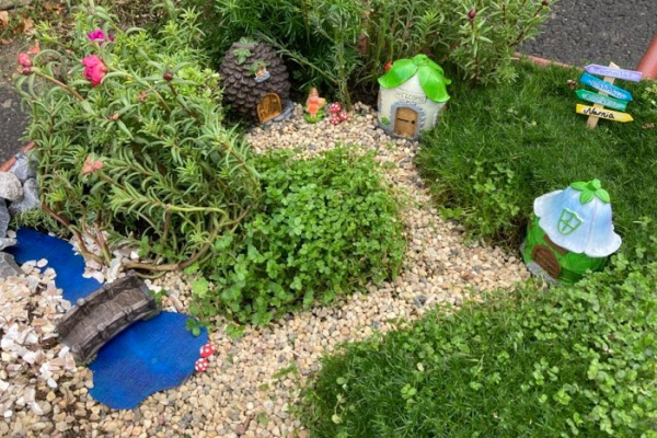 dollar tree fairy garden in a wheel barrow