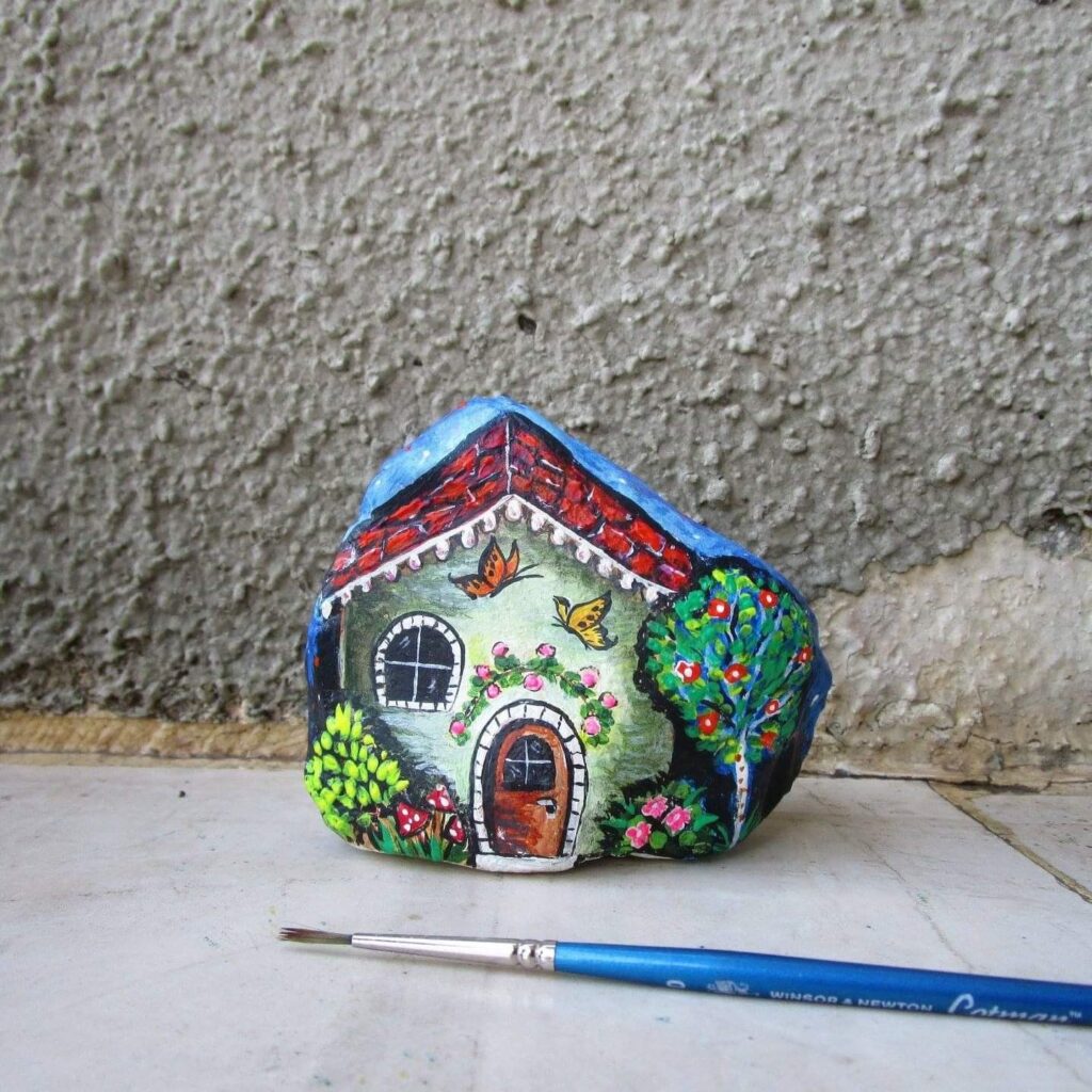 cottage painted on a stone