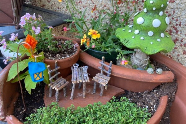 fairy garden created in a broken pot