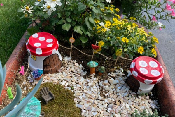 clay pot flower houses in a fairy garden