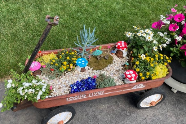 fairy garden in a wagon with clay pot toadstool fairy houses