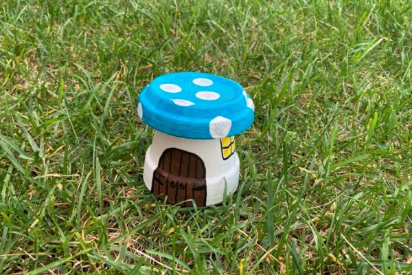 fairy house made out of clay flower pot