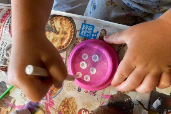 painting dots on clay pot toadstools